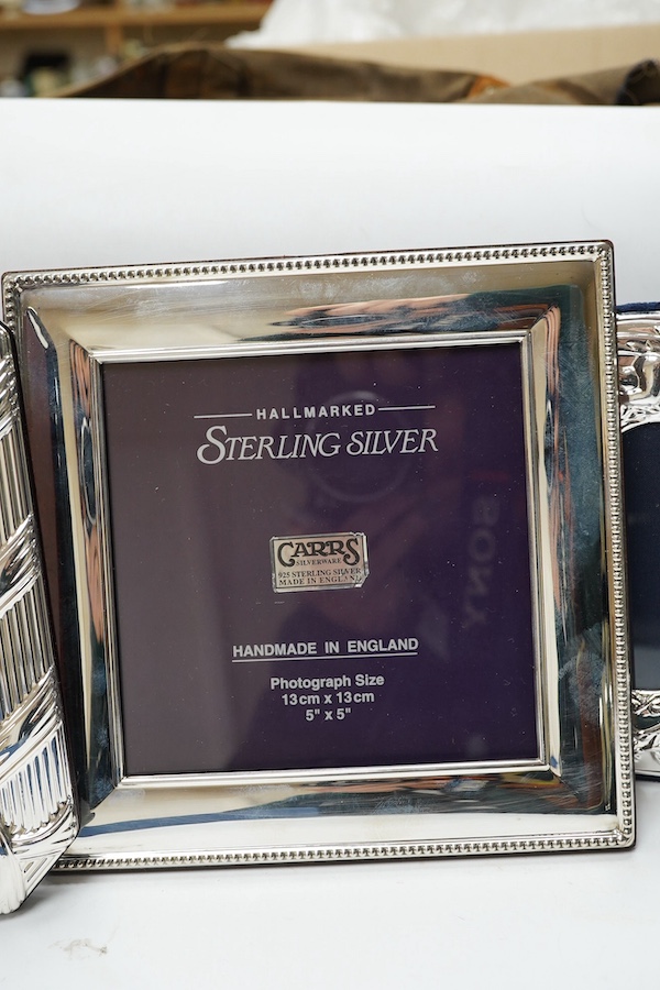 A modern boxed Carr's of Sheffield, silver mounted double photograph frame, width 18.3cm, together with two other silver mounted photograph frames and an Italian silver plated frame. Condition - good